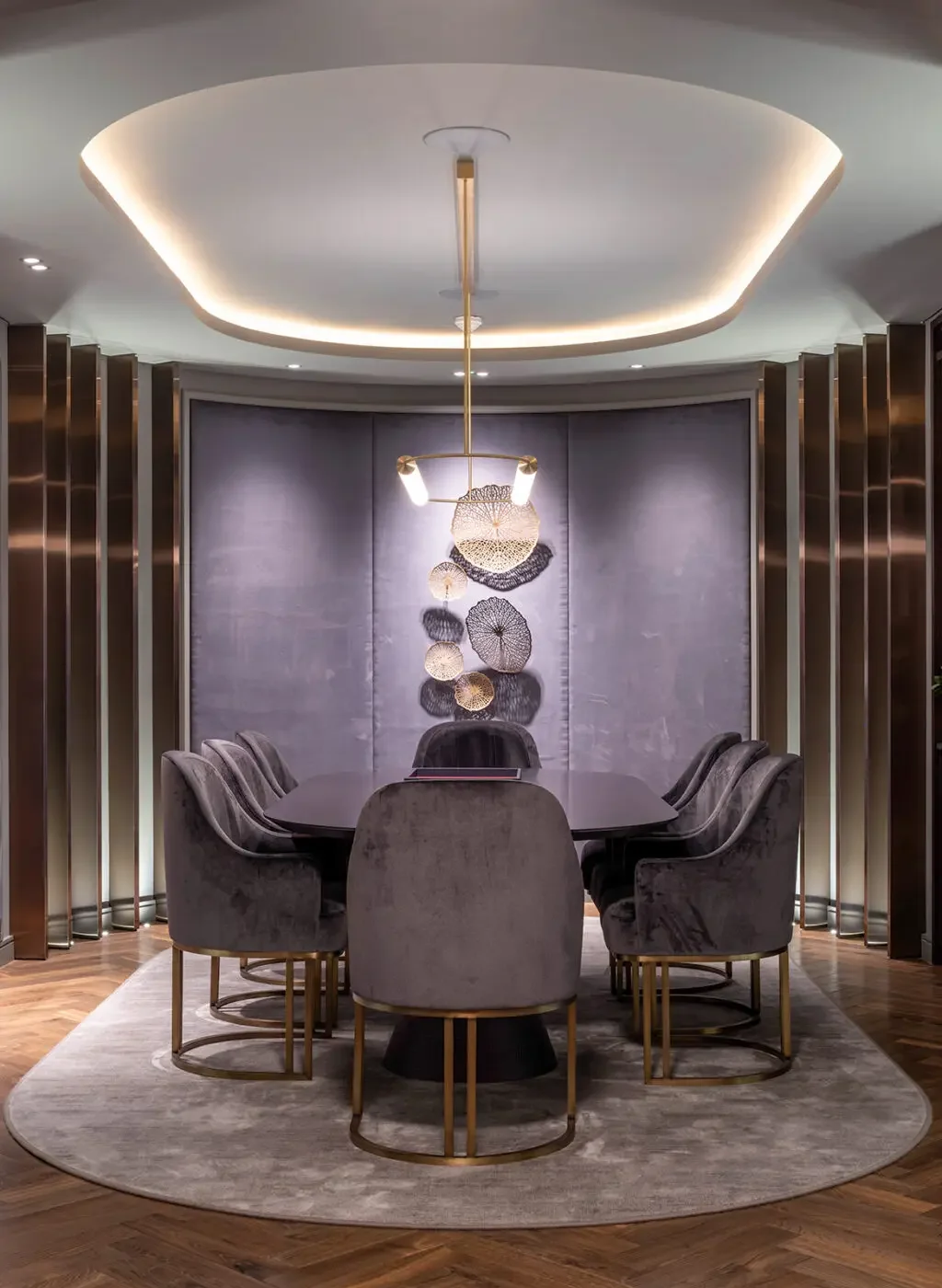 Buxmead dining room with sculptural wall artwork and dark timber joinery