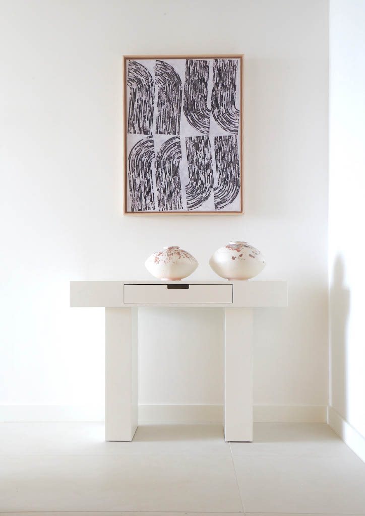 Shard Place artwork and object placement above a console